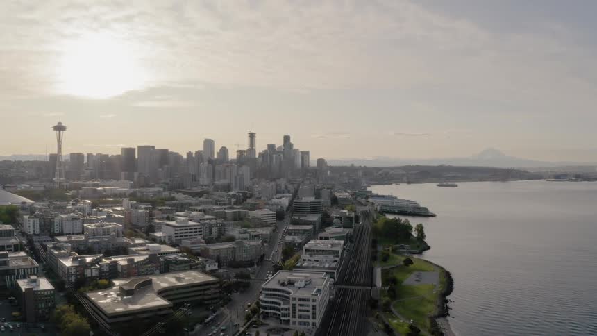 An aerial view of the sun setting in the horizon