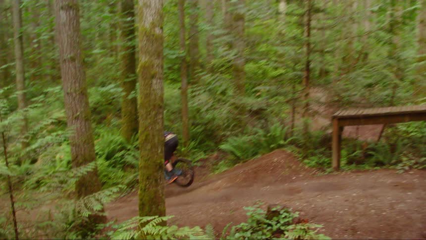 A man is doing tricks with a dirt bike