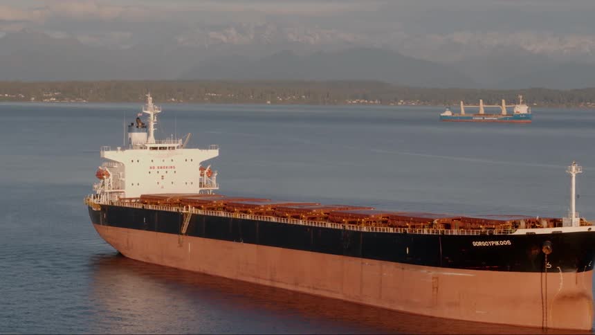 A large boat travels across the water