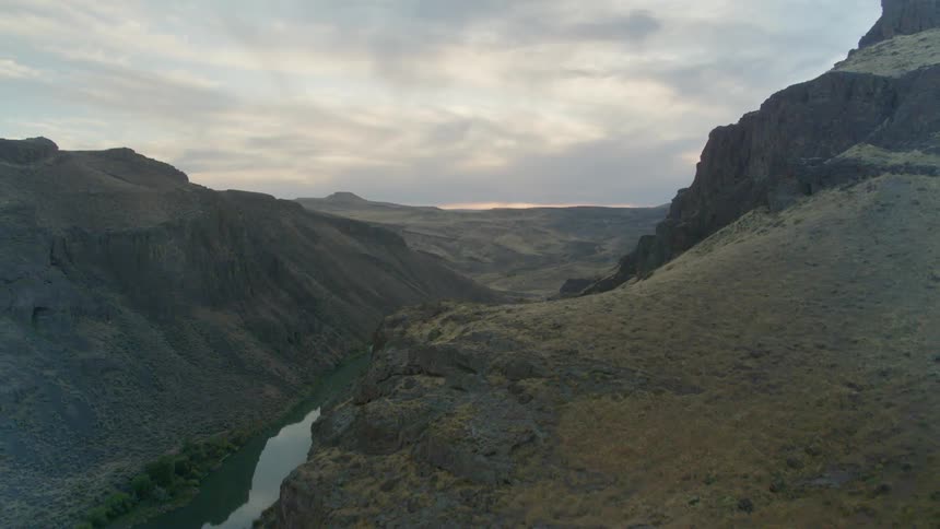 The stream runs between the mountains