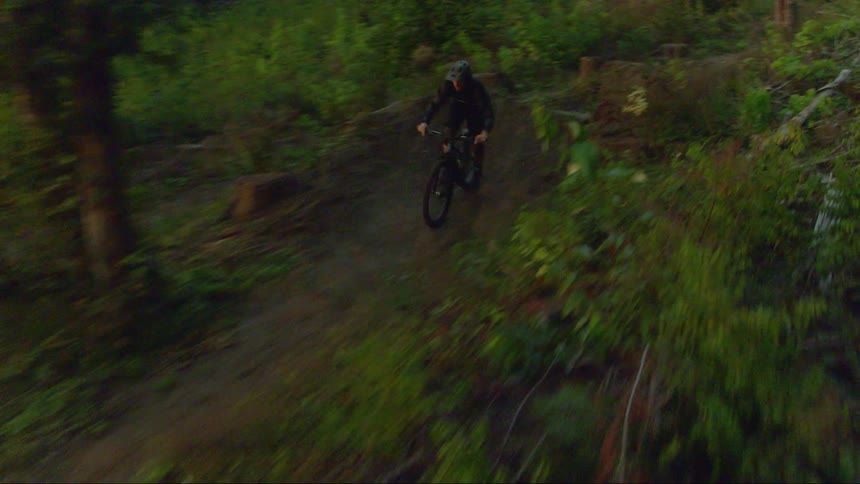 A man riding a mountain bike on a dirt trail