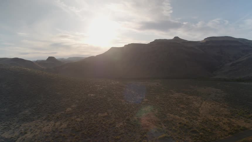 The road runs through the mountains ahead