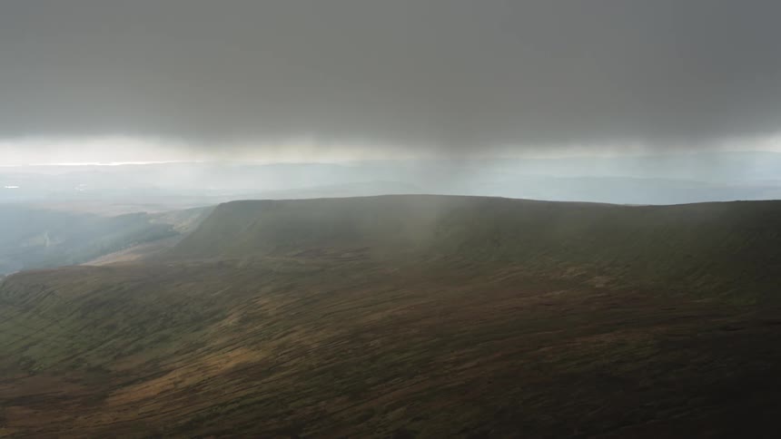Skyline view of a storm over hills