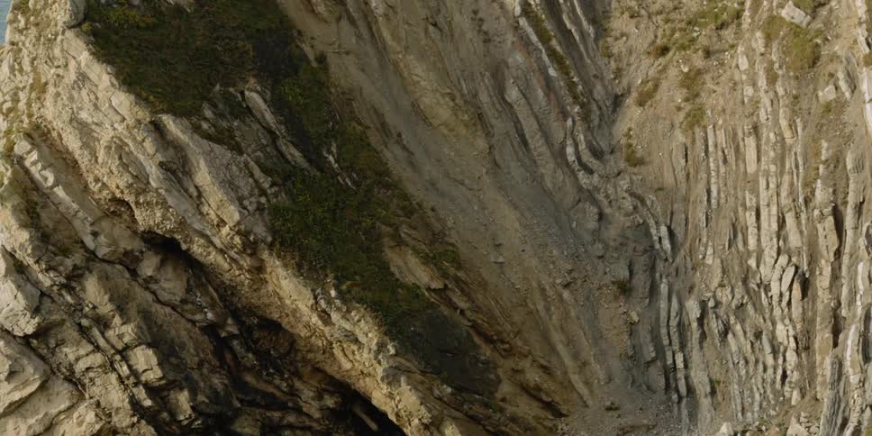 A promontory sits in the ocean