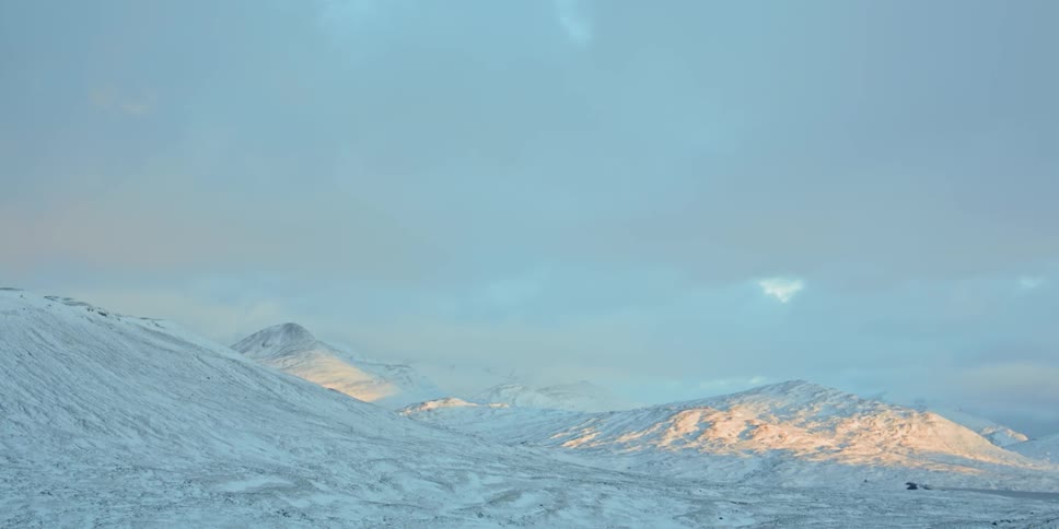 Landscape of snowy hills during daylight