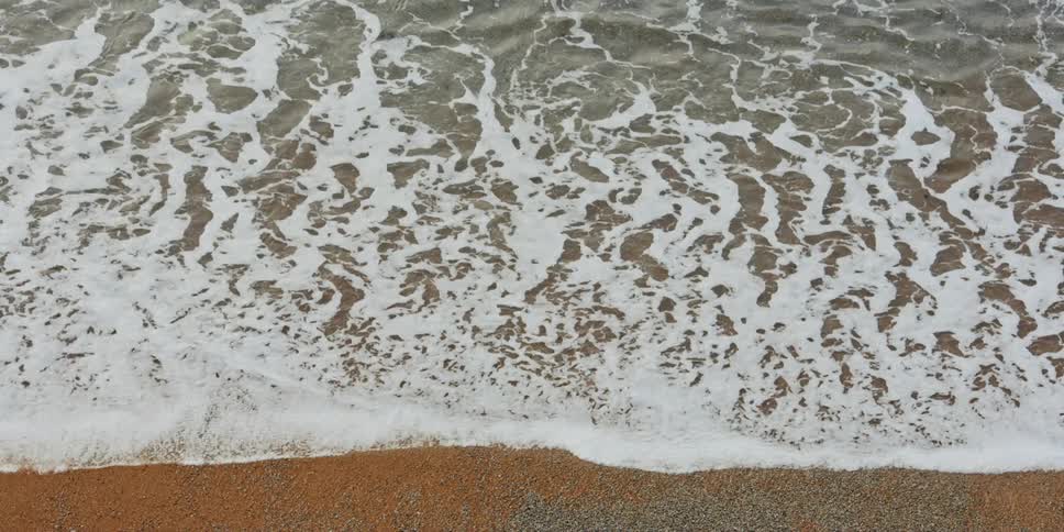 Waves crashing to the shoreline