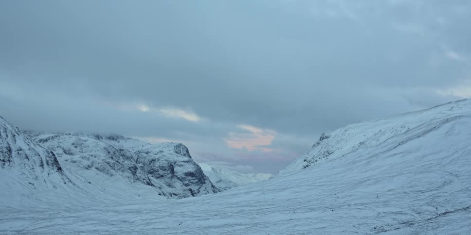 A view of a mountain covered in snow