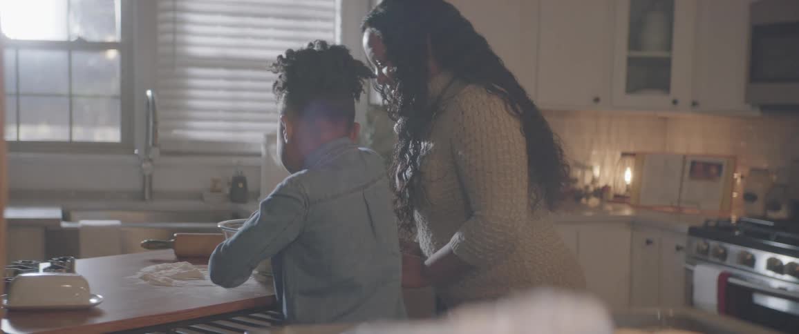 Woman and daughter are cooking together