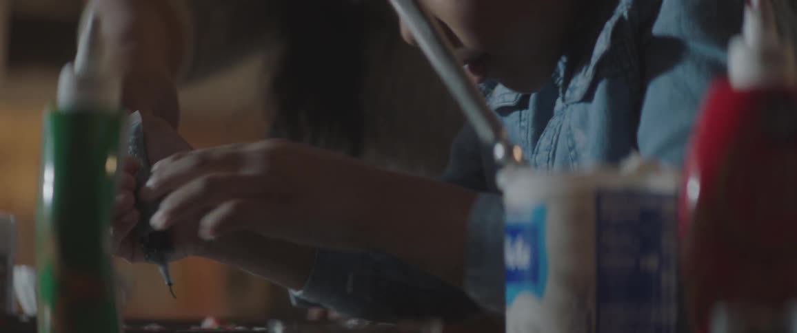 A girl help her mother cooking