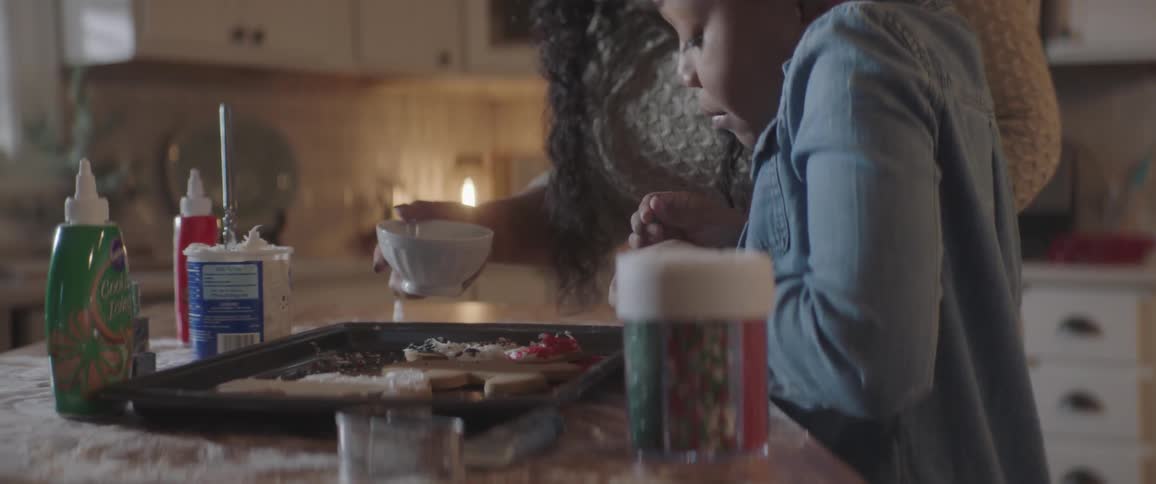 Girl put finishing and garnish at her cookie