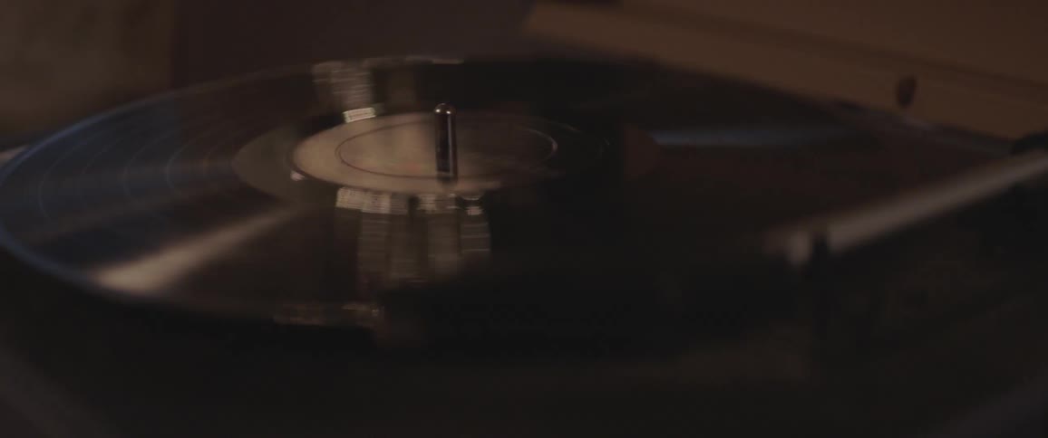 A vinyl record spinning on a record player