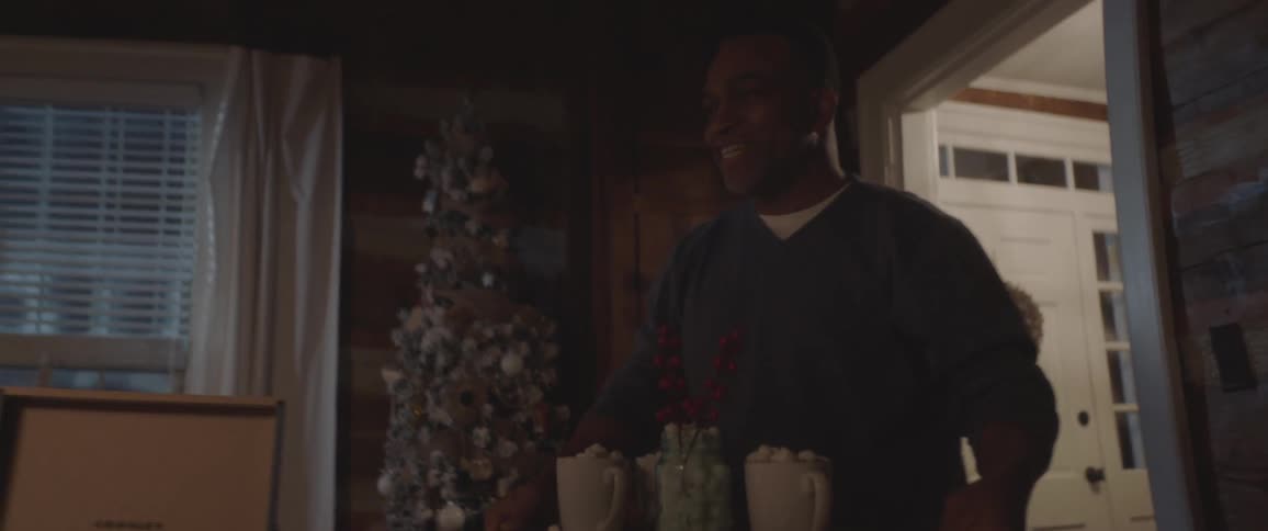 People walk into the living room serving hot cocoa