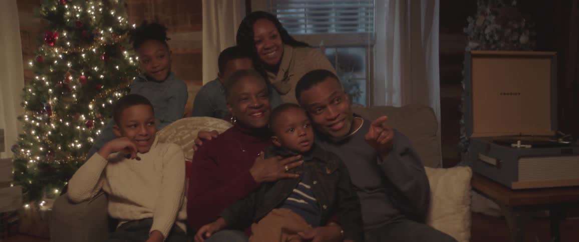 A family sit down to take a photograph