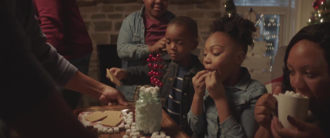 A family is eating food around a table