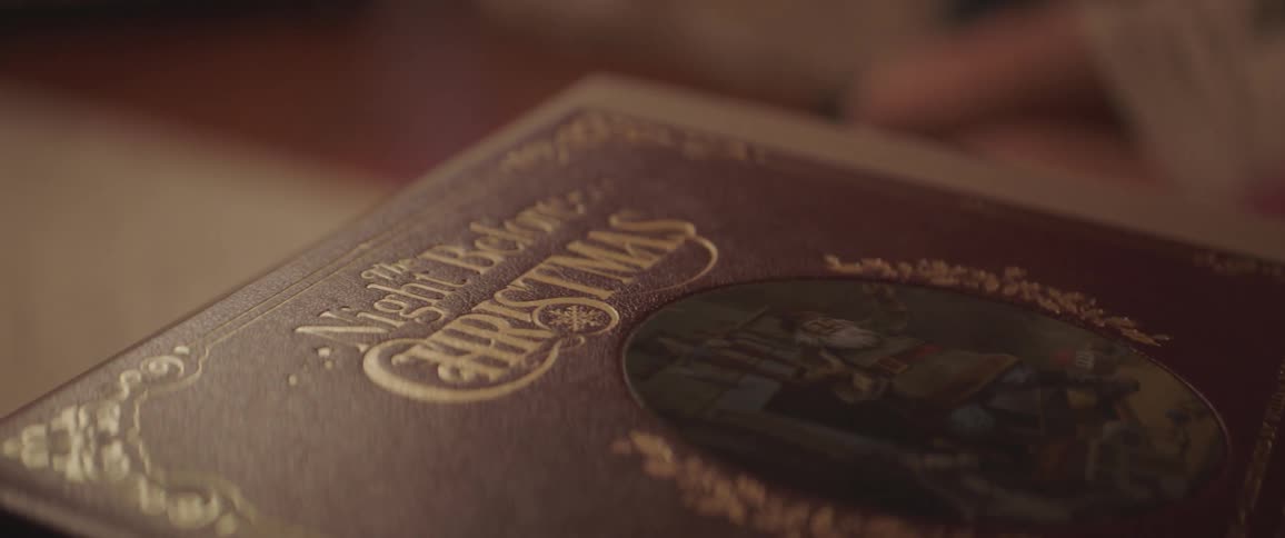 A copy of the night before christmas is sitting on a table
