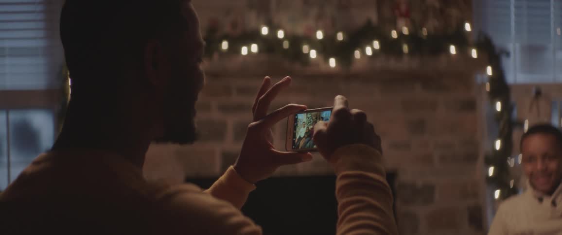 Father takes family pictures on christmas