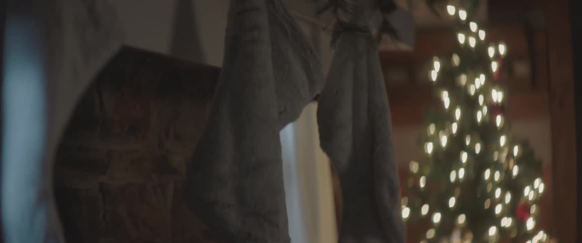 Christmas stockings hanging on a fireplace