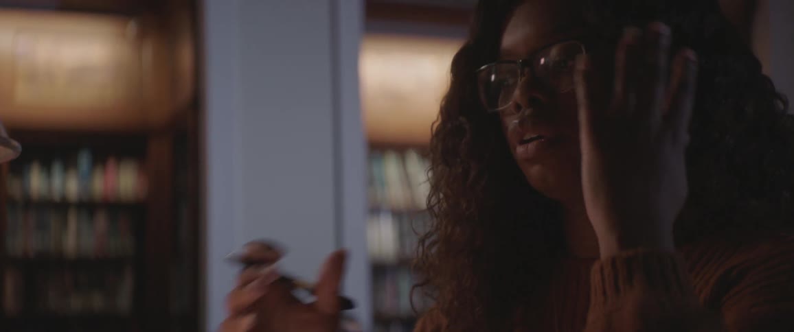 Black teenager working on the library