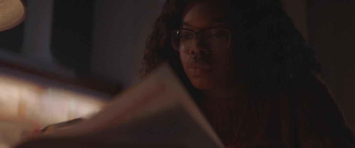 A woman pages through a book