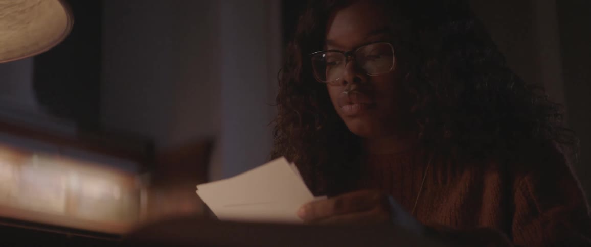 A woman is studying in the library