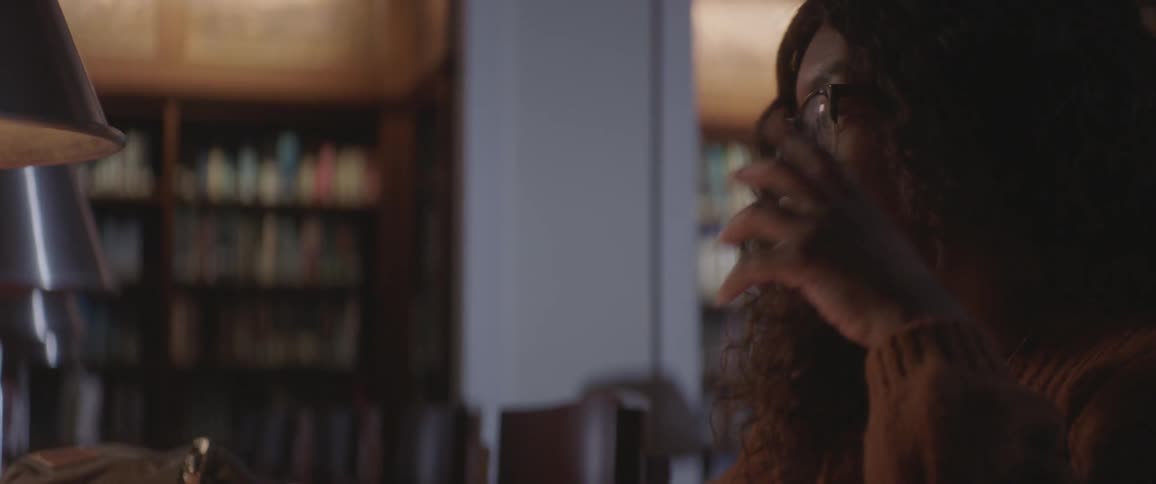 Woman studying on library