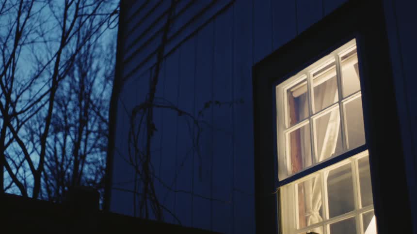 Light shines through a window in the evening