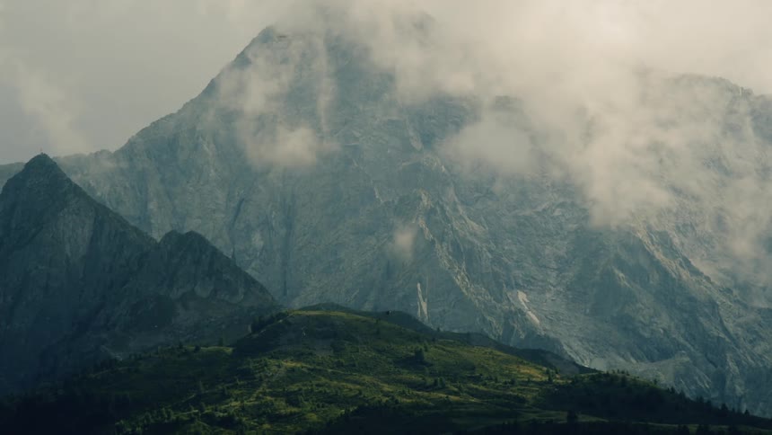 Clouds in front of a mountain range