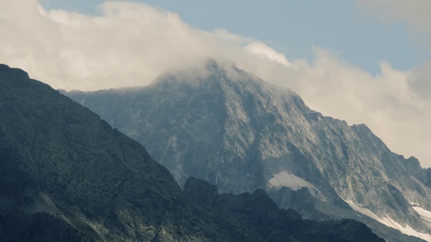 Clouds floating above a mountain range