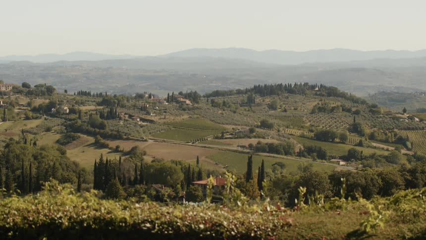 A village with a mountain and the sky in the background
