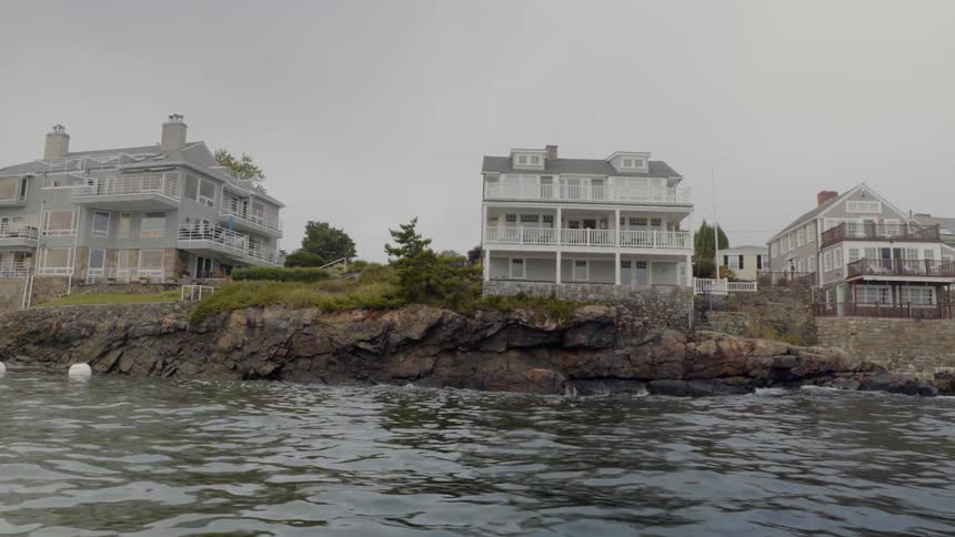 Large houses sit right along the shore