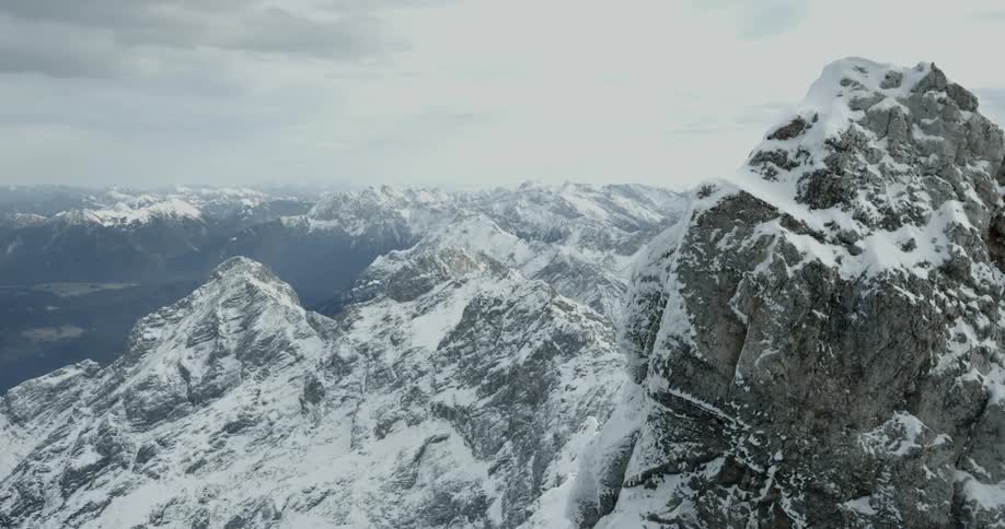 Snow covered mountain ranges with rough terrain