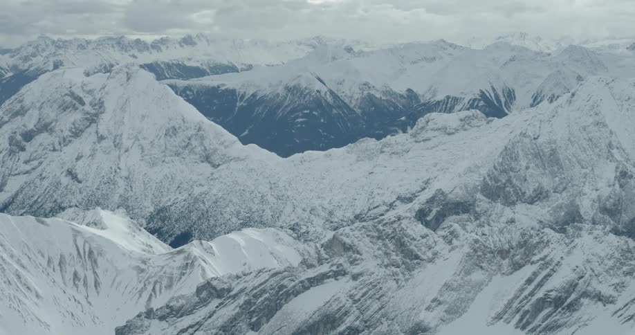 Mountains covered with snow with the sky in the background