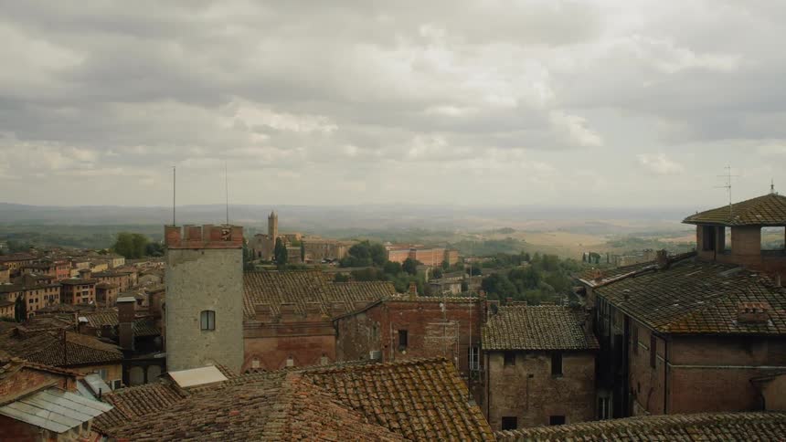 Clouds hang over an old city in the countryside