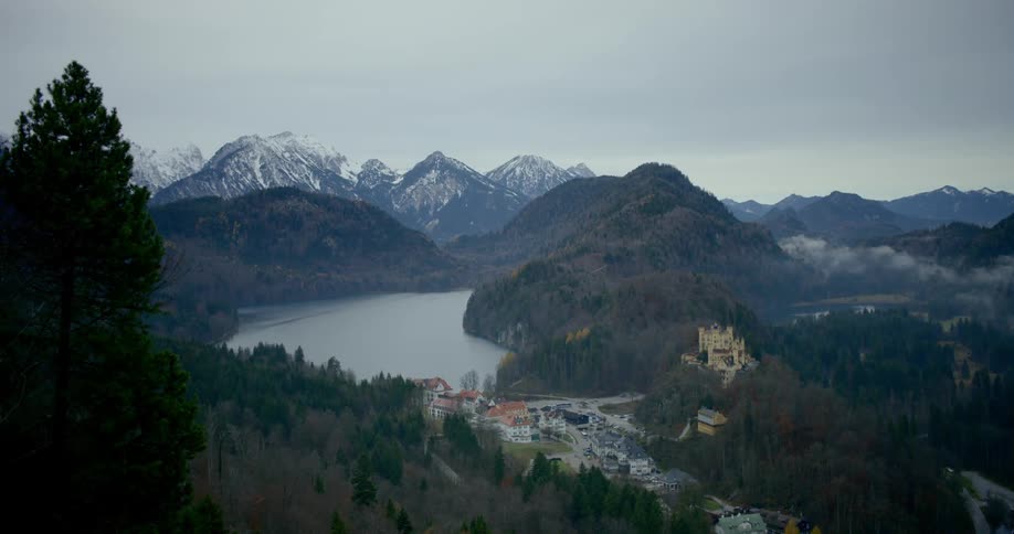 A lake lies in a valley in the mountains