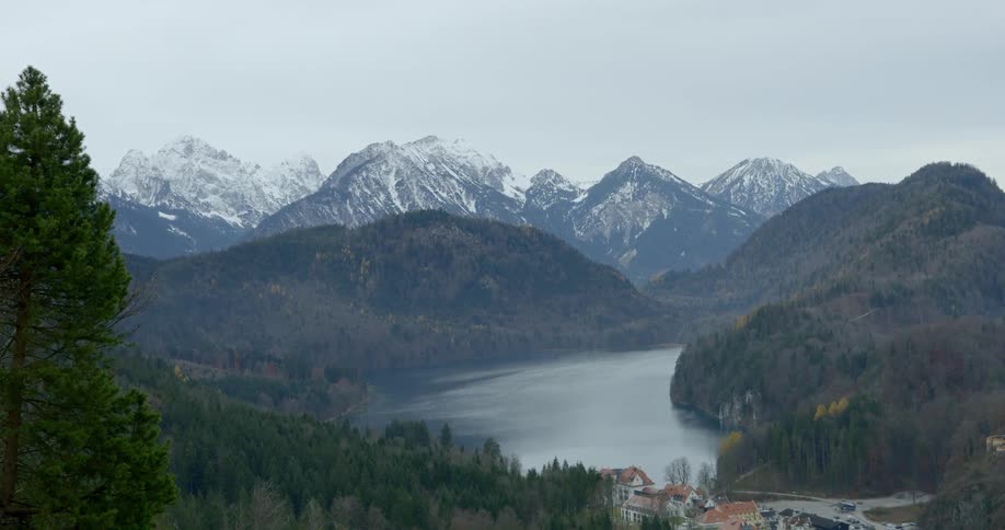 An aerial view of a lake surrounded by mountain range