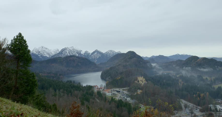 An aerial view of a beautiful lake forest and mountain range