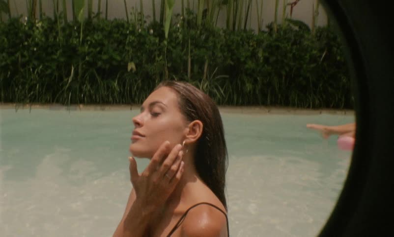 A sexy woman with swimsuit in the swimming pool