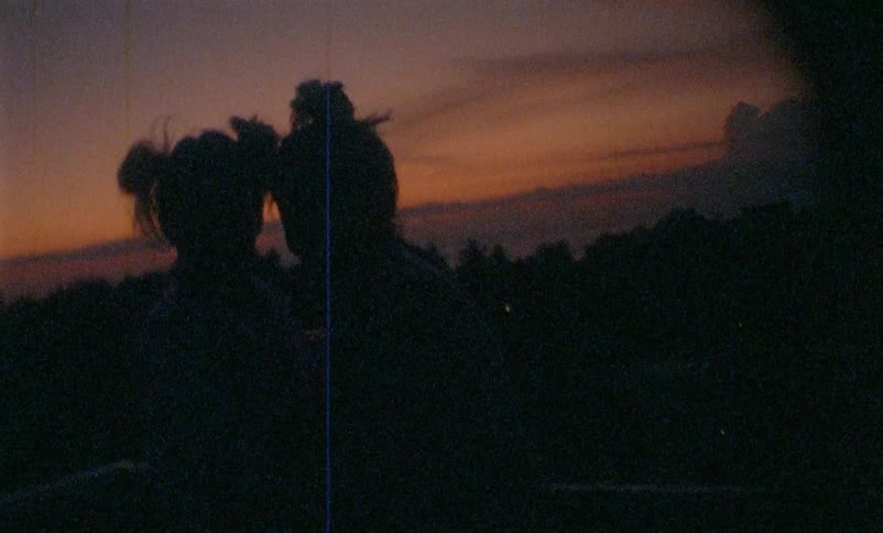 A film where two women dance and hug and laugh as the sun sets