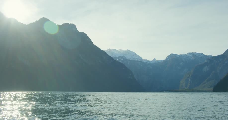 Snow capped mountains on the coast off the water