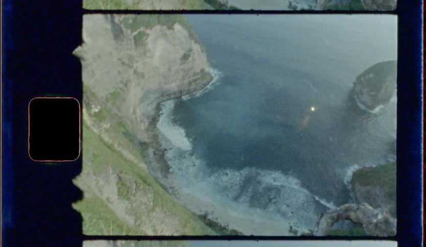 An aerial view of a cliff near ocean