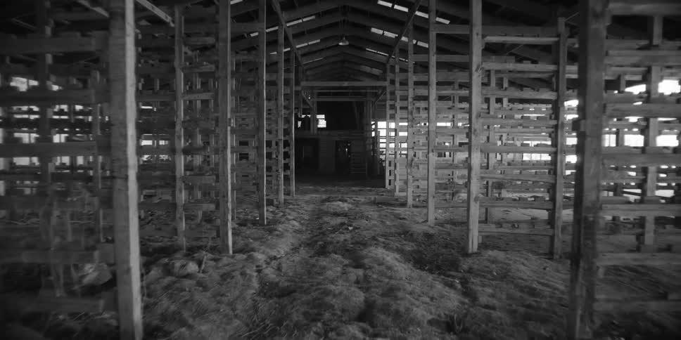 Moving through the inside of a warehouse with rows of racks
