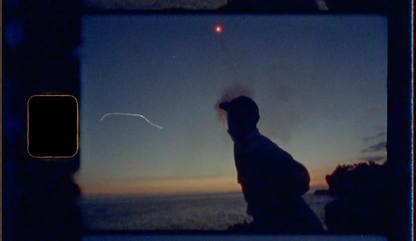 A man play firework at the coastal