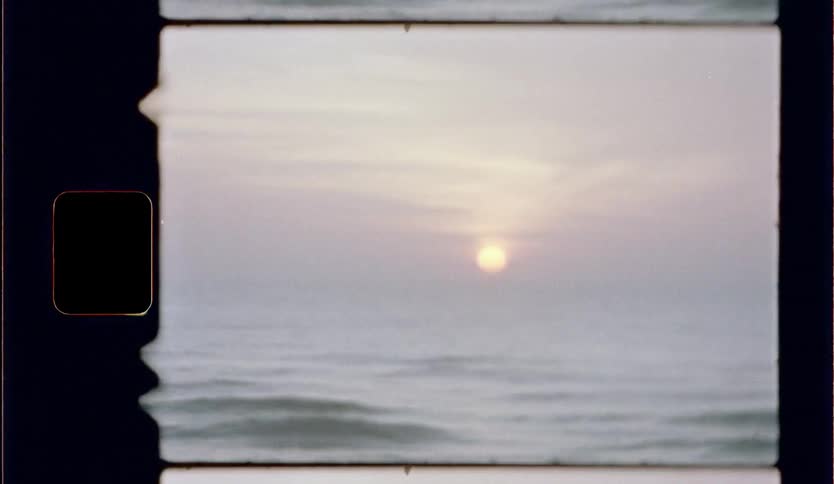 Film footage of the sun over the water