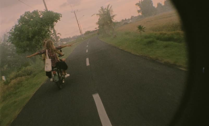 Couple ride motorcycle at the rural road