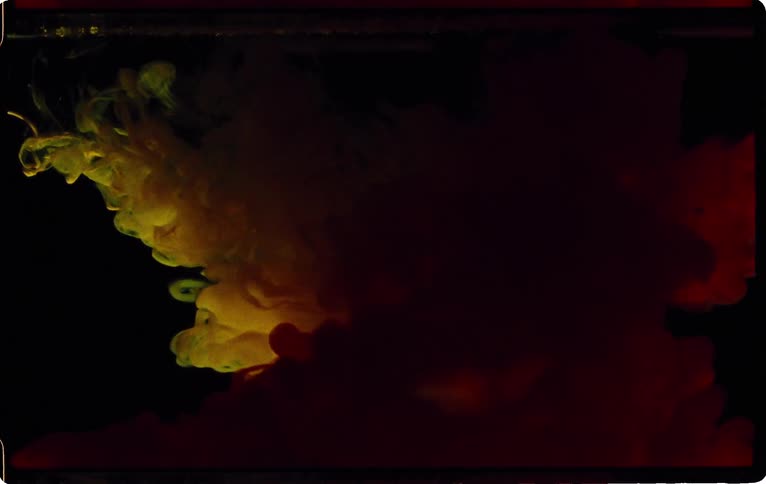 Puffs of red and yellow smoke blend together