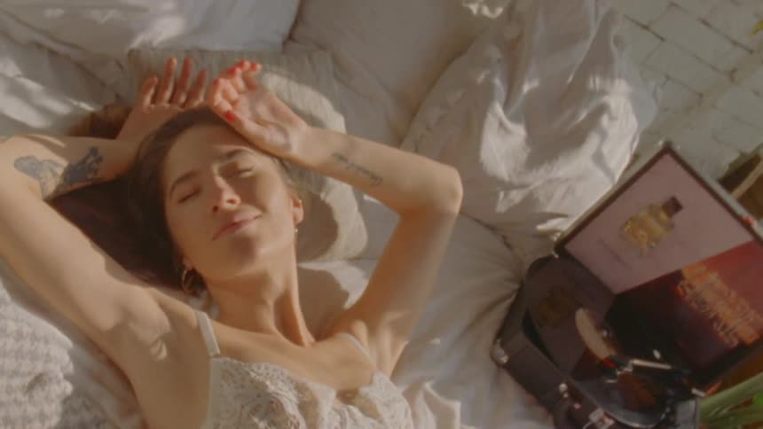 A beautiful woman waking up from the bed