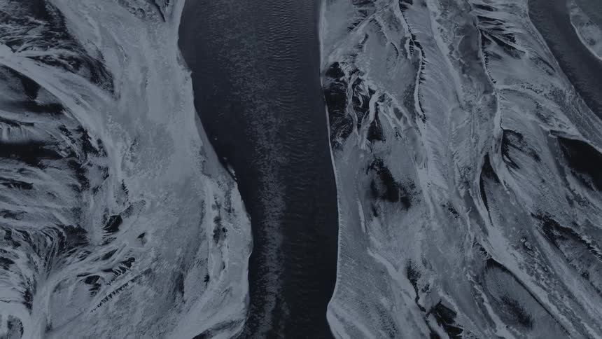 Water flows through channel in glacier