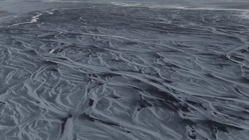 Birds eye view of a beach and water