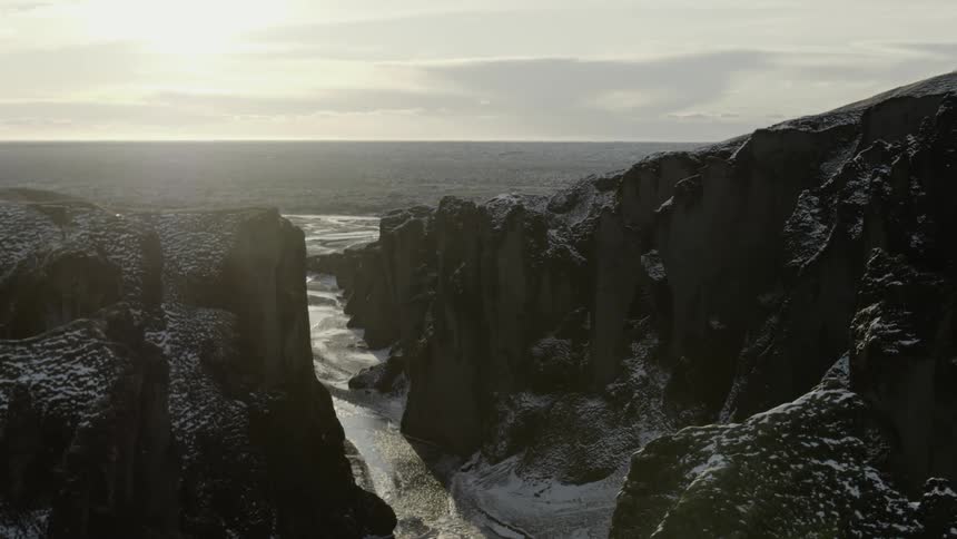 Aerial shot of a cliff by the ocean
