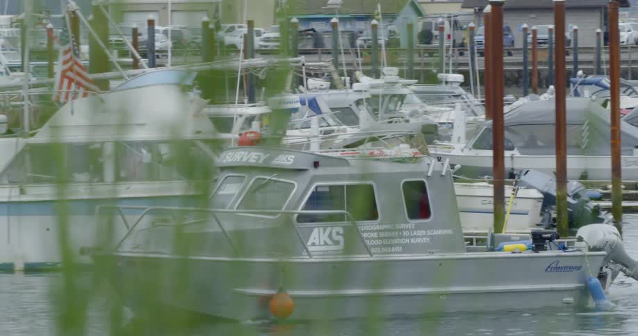Boat drives out of marina during the day